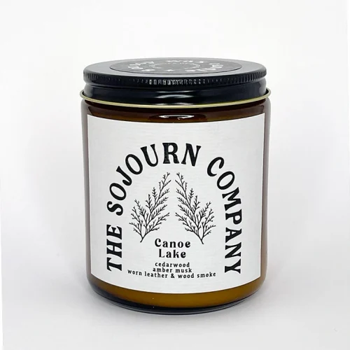 Sojourn Company Canoe Lake Woodsmoke and Leather 8oz Soy Candles in and Amber Glass Jar